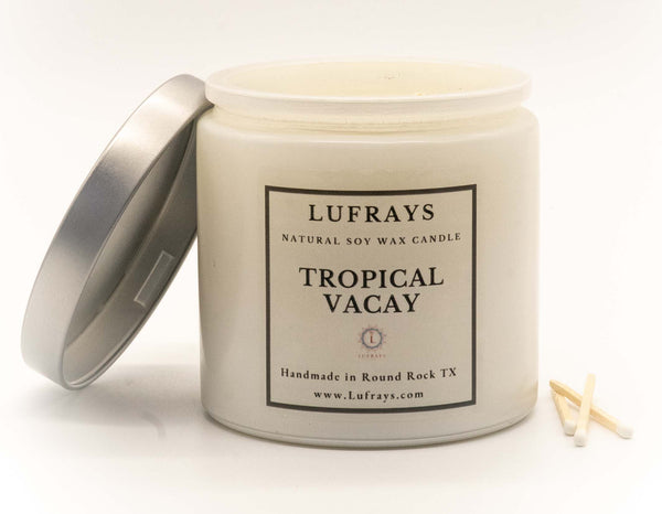 Handmade two wick soy candle in white jar with silver lid in Tropical Vacay fragrance.